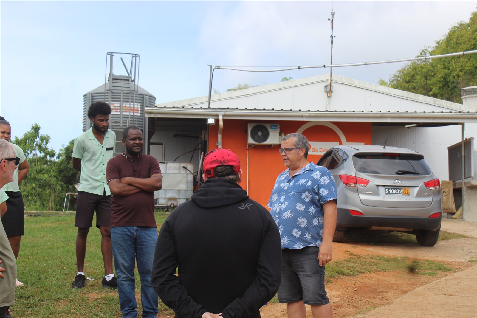 SIAH and University of Seychelles students with GreenTraINT partners receiving a briefing during the farm visit