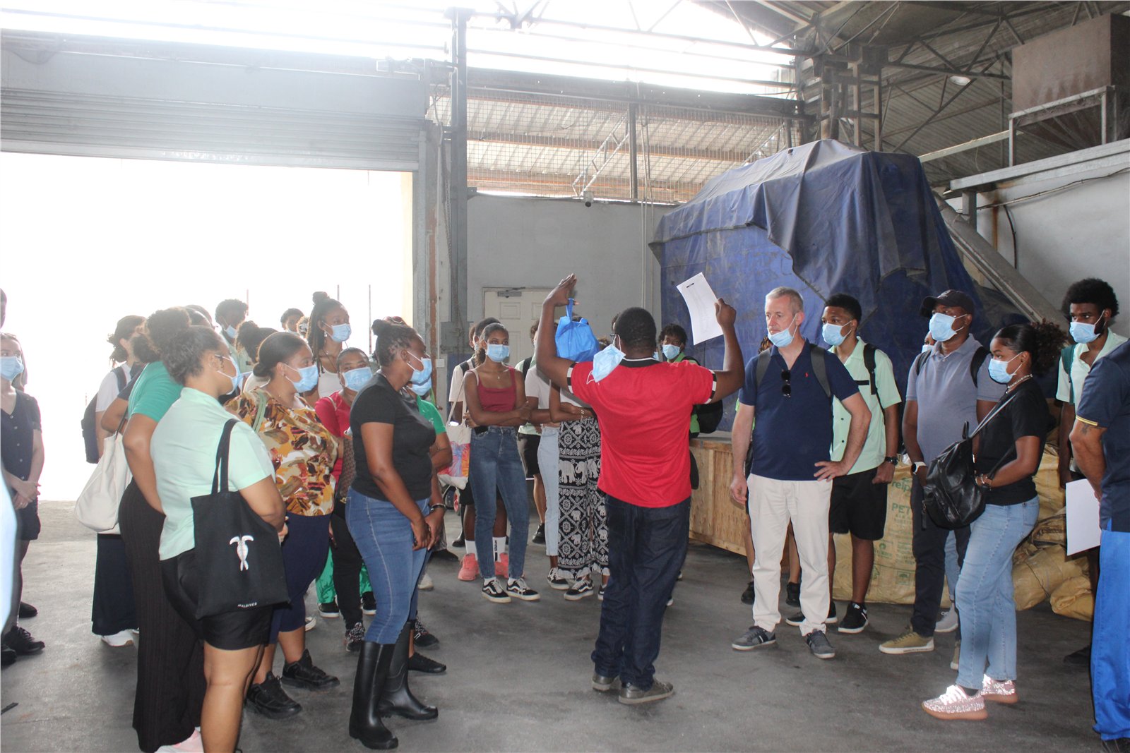 Facility representative briefing GreenTraINT participants during the Ferox Feeds visit